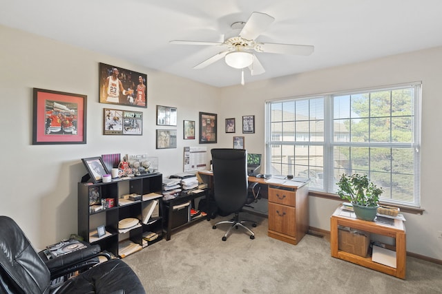 carpeted office featuring ceiling fan