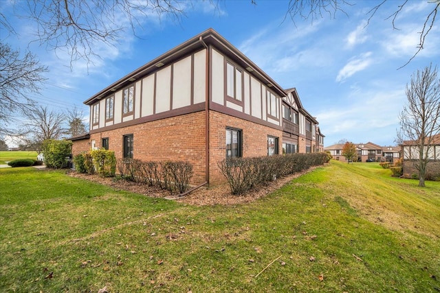 view of home's exterior with a lawn