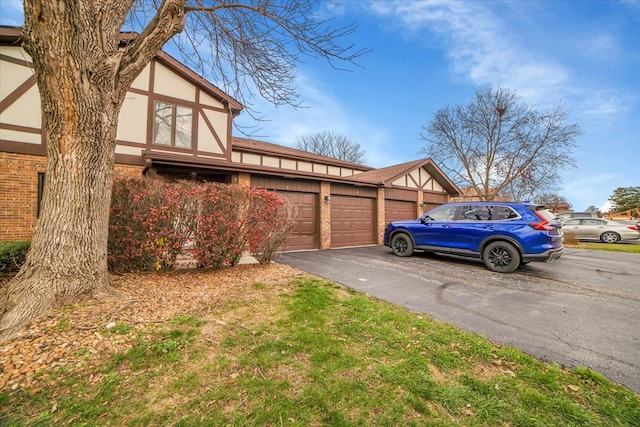 view of side of home with a garage