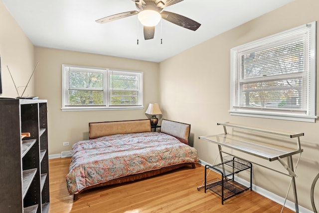 bedroom featuring wood-type flooring and ceiling fan