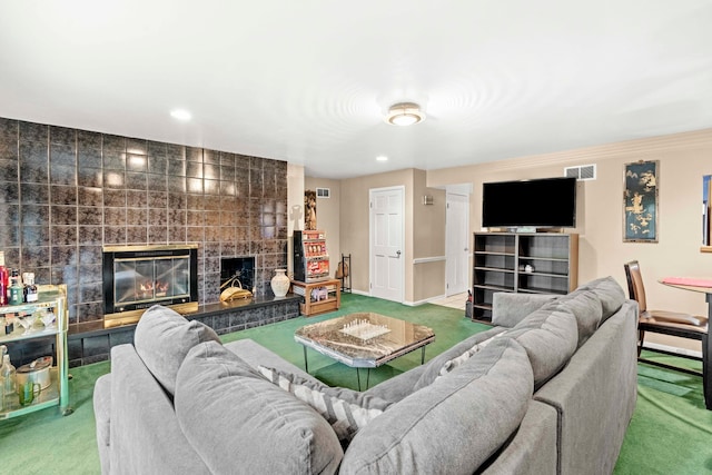 carpeted living room featuring a fireplace