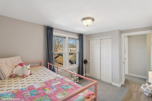 bedroom featuring a closet, carpet, and baseboards