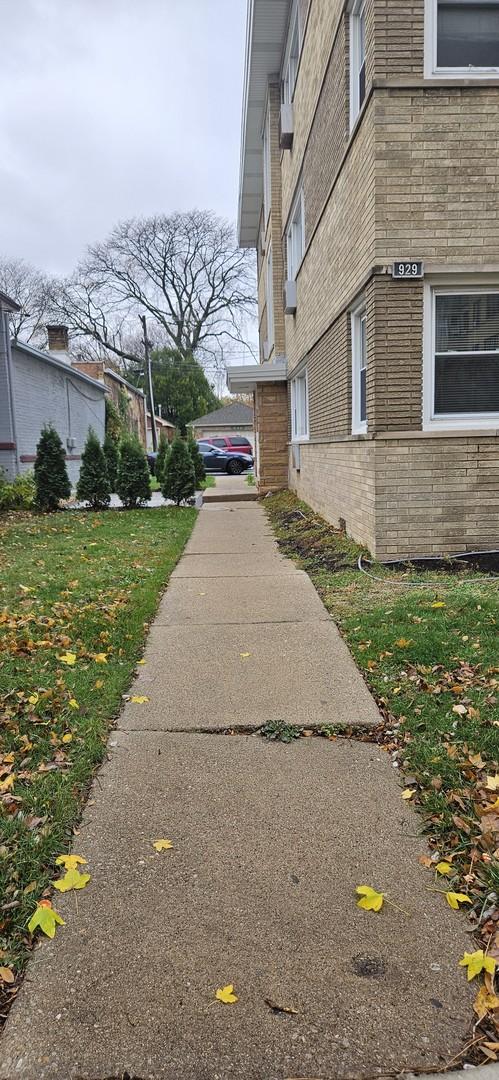 view of property exterior featuring a lawn