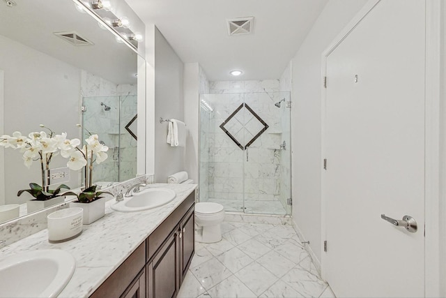 bathroom featuring vanity, toilet, and walk in shower