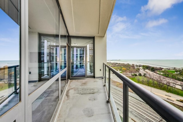 balcony featuring a water view