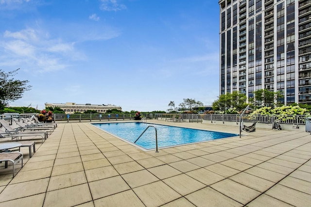 view of swimming pool featuring a patio area