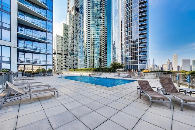 view of swimming pool with a patio