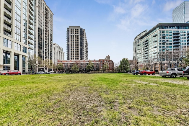 view of home's community featuring a lawn