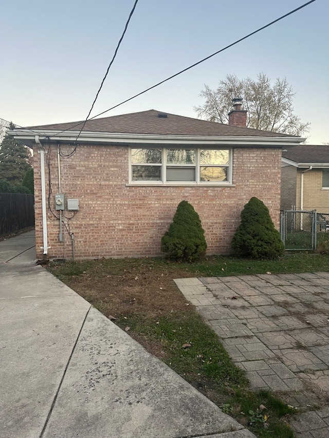 view of side of property with a patio