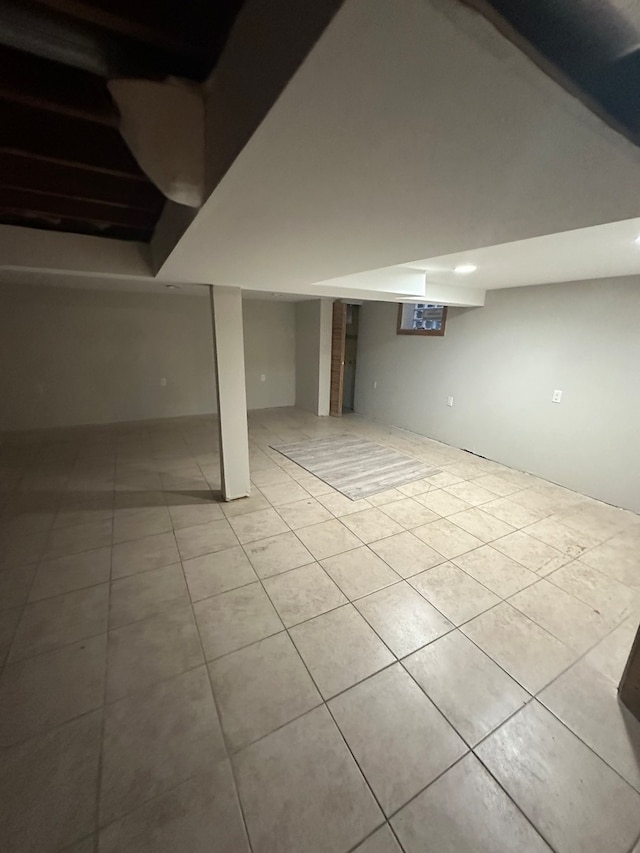 basement featuring light tile patterned floors