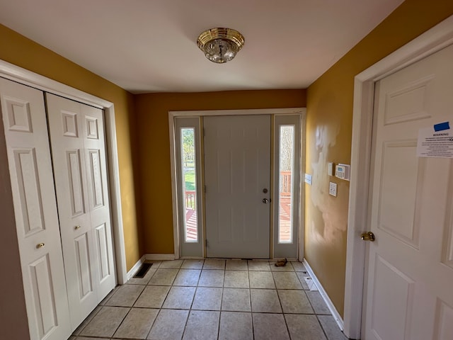 entryway featuring light tile patterned floors