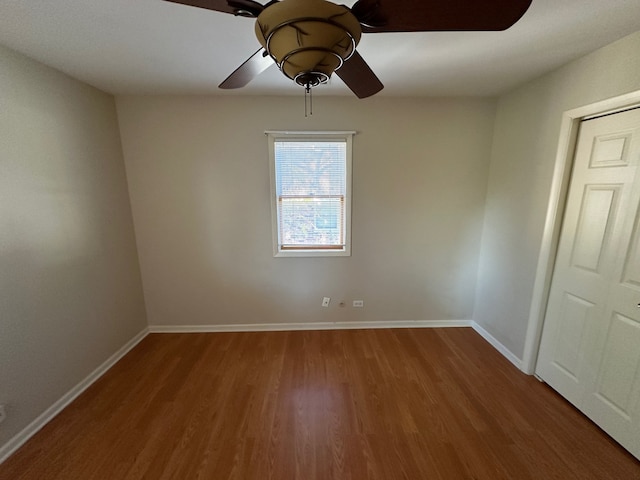 unfurnished room with wood-type flooring and ceiling fan