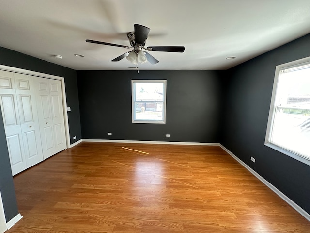 unfurnished bedroom featuring light hardwood / wood-style flooring and ceiling fan