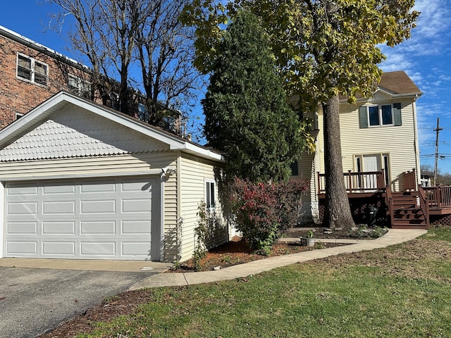 view of front of property with a garage and a deck