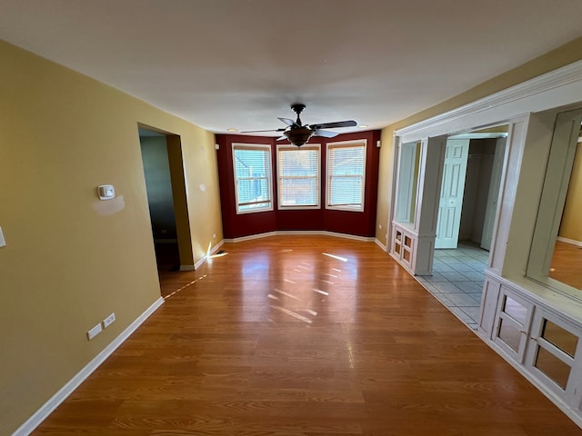 interior space featuring hardwood / wood-style floors and ceiling fan