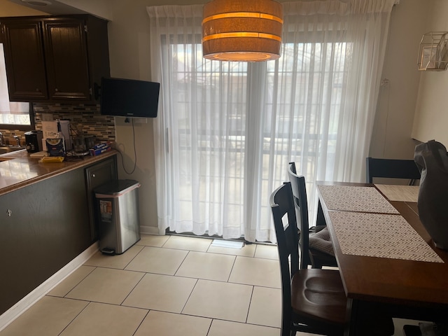 dining room featuring light tile patterned flooring