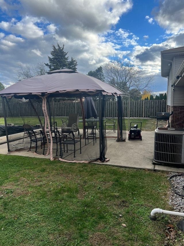 view of property's community with a gazebo, a patio area, and a yard