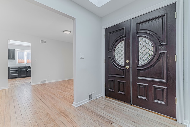 foyer entrance featuring light wood-type flooring