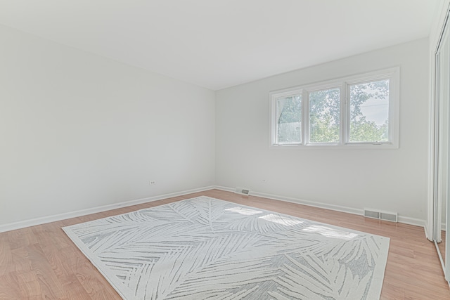 spare room with light wood-type flooring