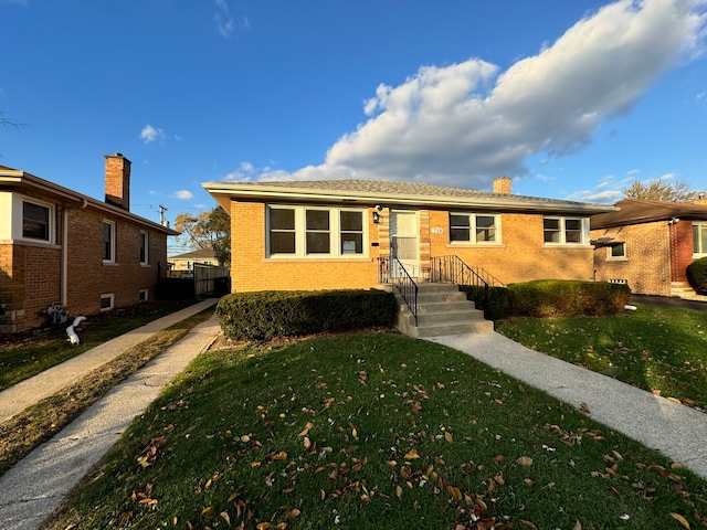 view of front facade featuring a front yard