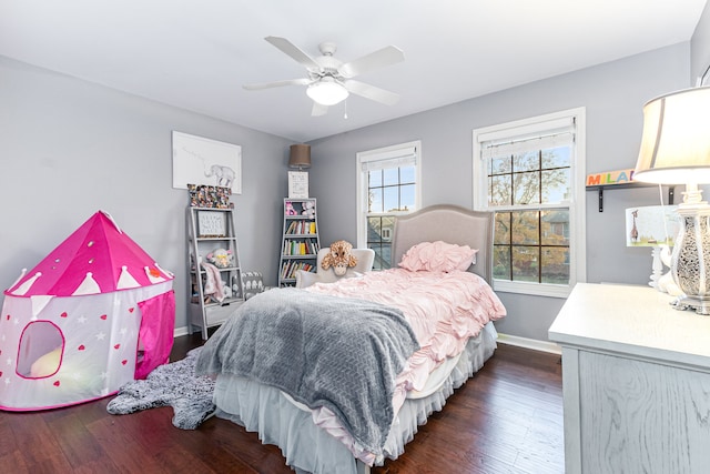 bedroom featuring ceiling fan and dark wood-type flooring