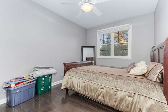 bedroom featuring ceiling fan and dark hardwood / wood-style floors