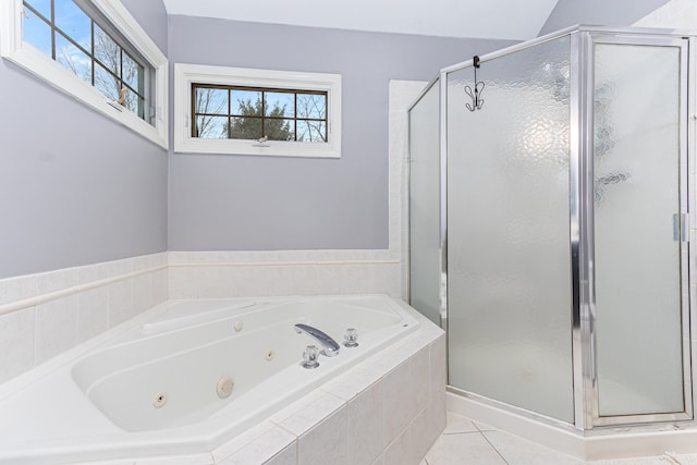 bathroom with tile patterned floors, shower with separate bathtub, and a wealth of natural light