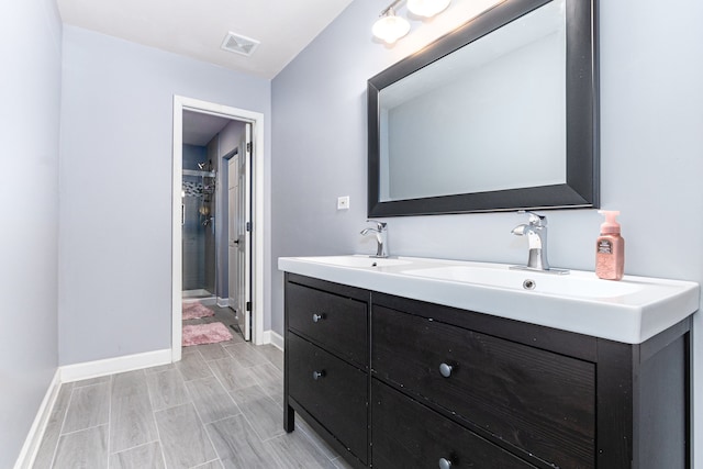 bathroom with vanity and wood-type flooring