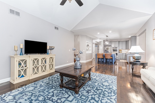 living room featuring wood-type flooring, ceiling fan, and lofted ceiling