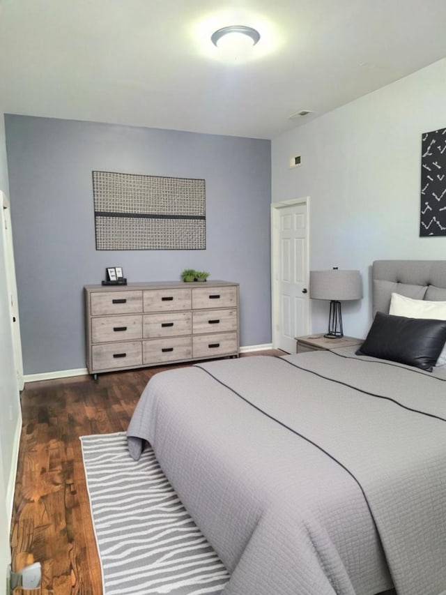 bedroom featuring dark hardwood / wood-style floors