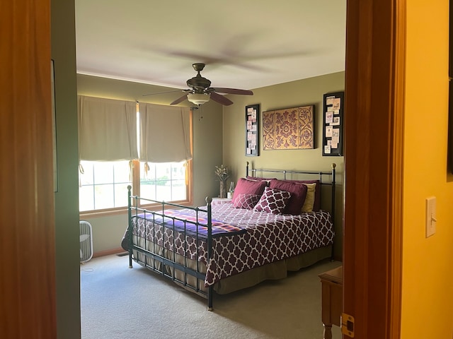 bedroom with ceiling fan and carpet