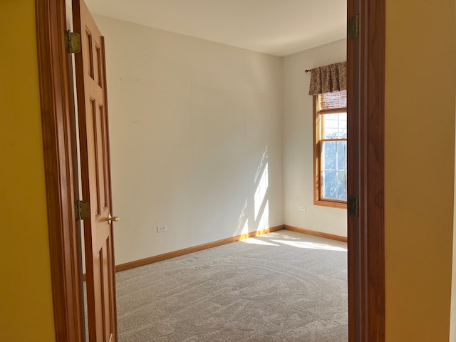 empty room with light colored carpet