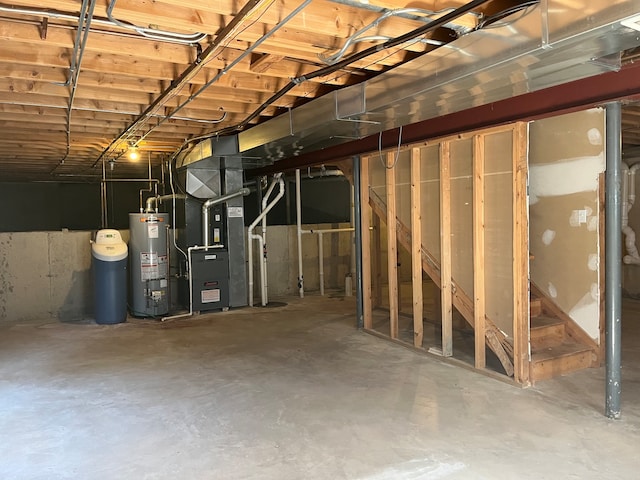 basement with gas water heater and heating unit