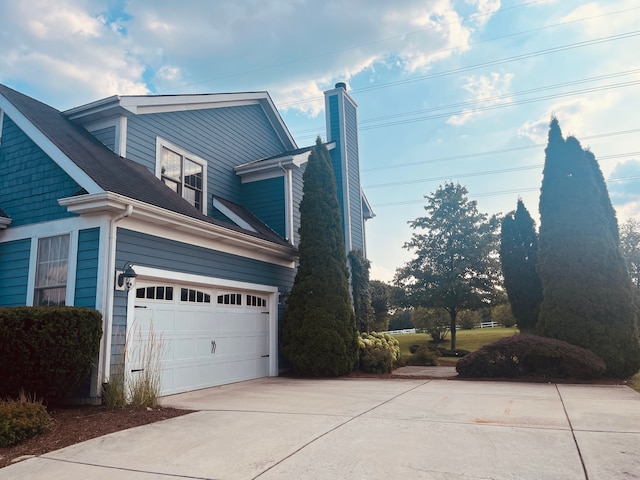 view of side of property with a garage