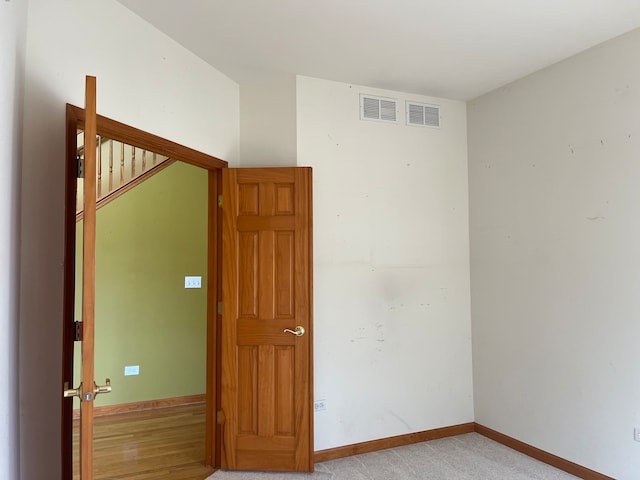 unfurnished room featuring light hardwood / wood-style floors