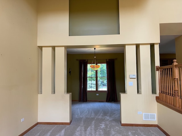 interior space featuring dark colored carpet