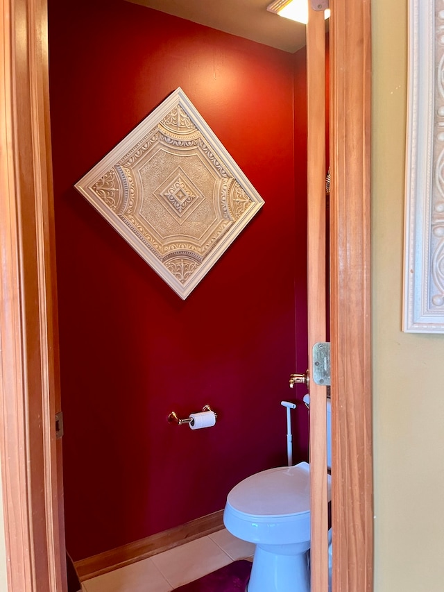 bathroom featuring toilet and tile patterned floors