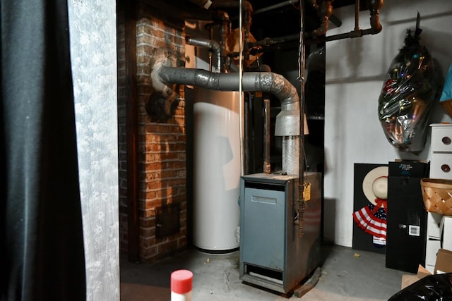 utility room featuring water heater