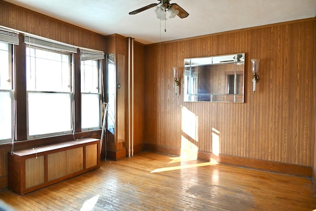 spare room with ceiling fan and light hardwood / wood-style floors