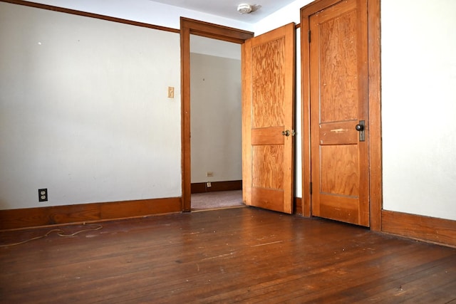 spare room featuring dark hardwood / wood-style flooring