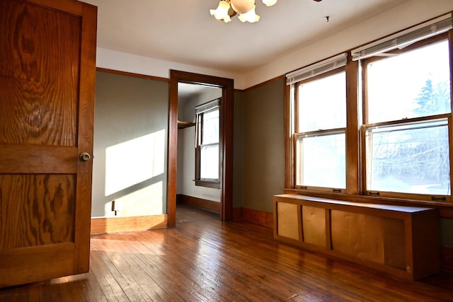 interior space with dark hardwood / wood-style flooring and a chandelier