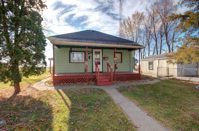 bungalow featuring a porch and a front yard