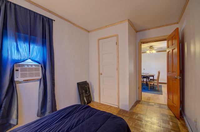 bedroom featuring light parquet flooring, cooling unit, and crown molding