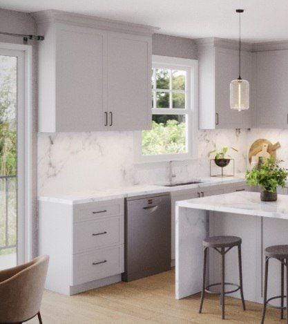 kitchen with stainless steel dishwasher, a kitchen breakfast bar, decorative light fixtures, and a wealth of natural light