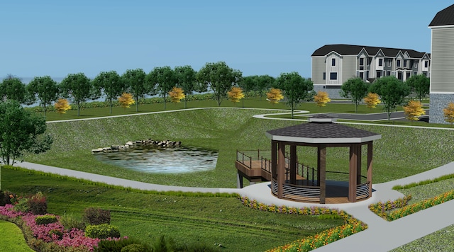 surrounding community with a gazebo, a water view, and a lawn