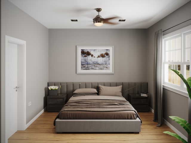 bedroom with light hardwood / wood-style floors and ceiling fan