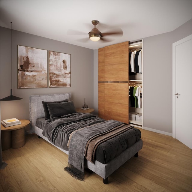 bedroom featuring ceiling fan and hardwood / wood-style flooring