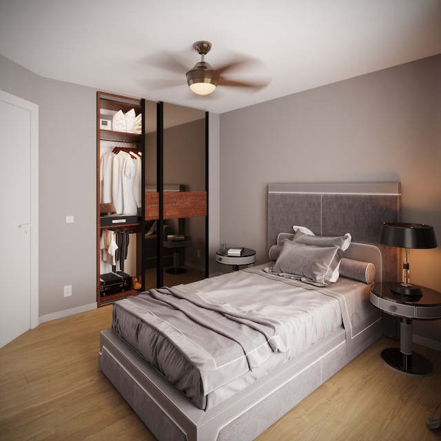 bedroom with light wood-type flooring and ceiling fan