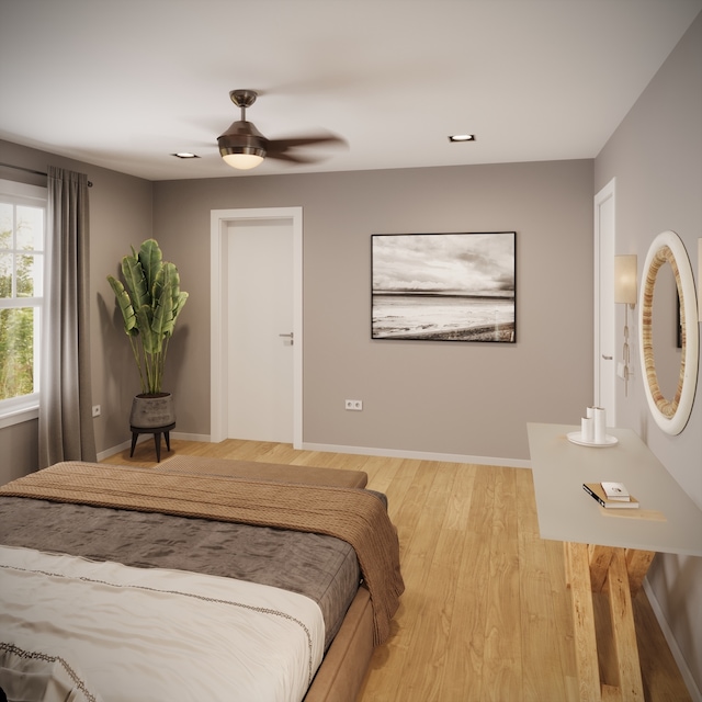 bedroom with ceiling fan and light hardwood / wood-style flooring