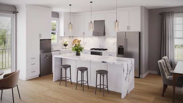 kitchen featuring white cabinetry, a center island, backsplash, extractor fan, and black appliances